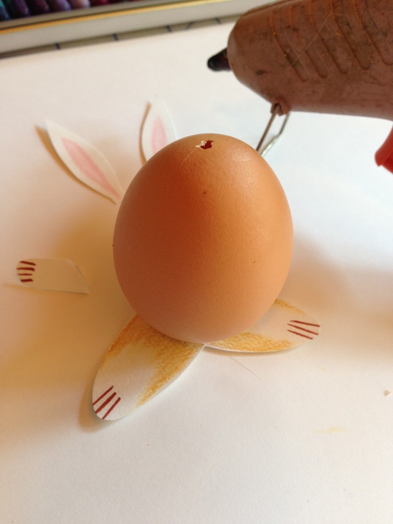 Glue the appendages to the egg.